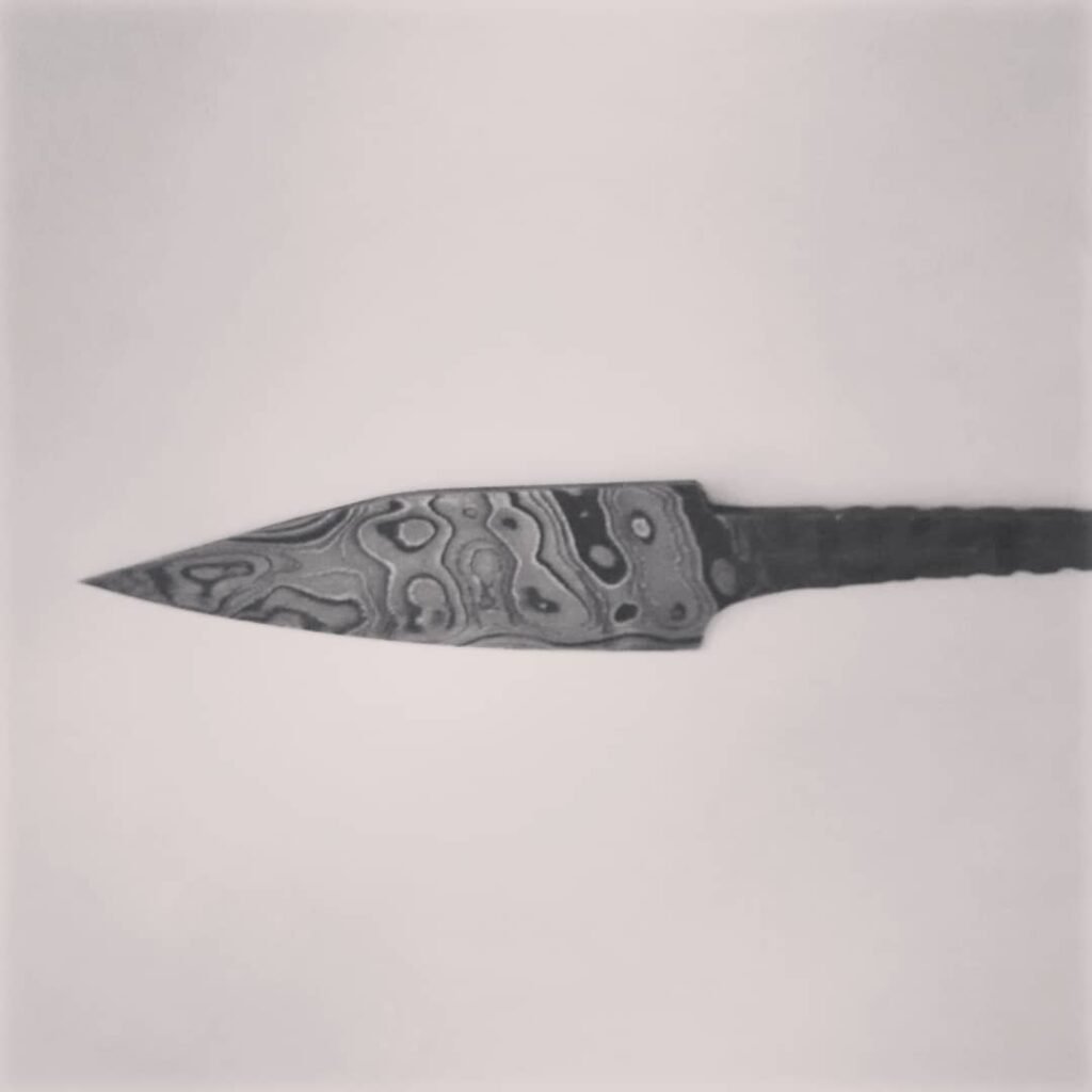 clownfish pattern carving blade 15N20 and 1095 pattern weld 2.5 inchec long three quarters inch wide zero ground broken back